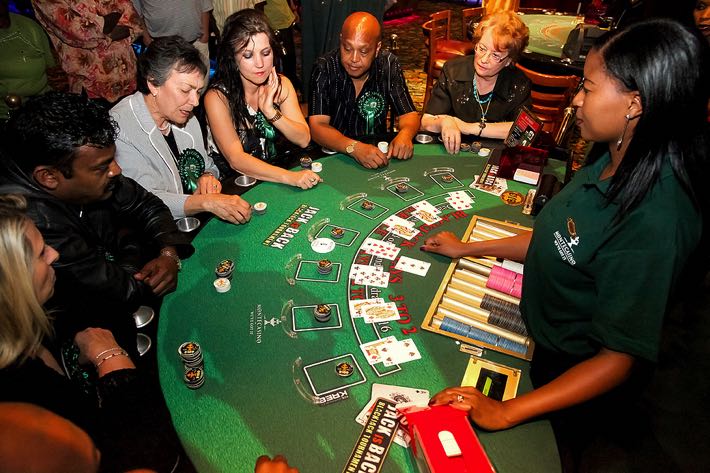 People playing Blackjack in a casino