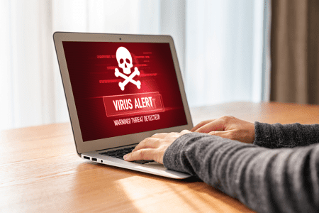 Virus alert notice on laptop computer
